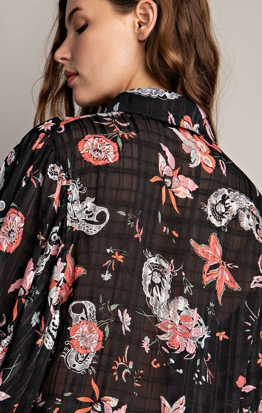 Black sheer blouse with peach and white paisley pattern. Button down front, bishop sleeves, and smocked cuffs.