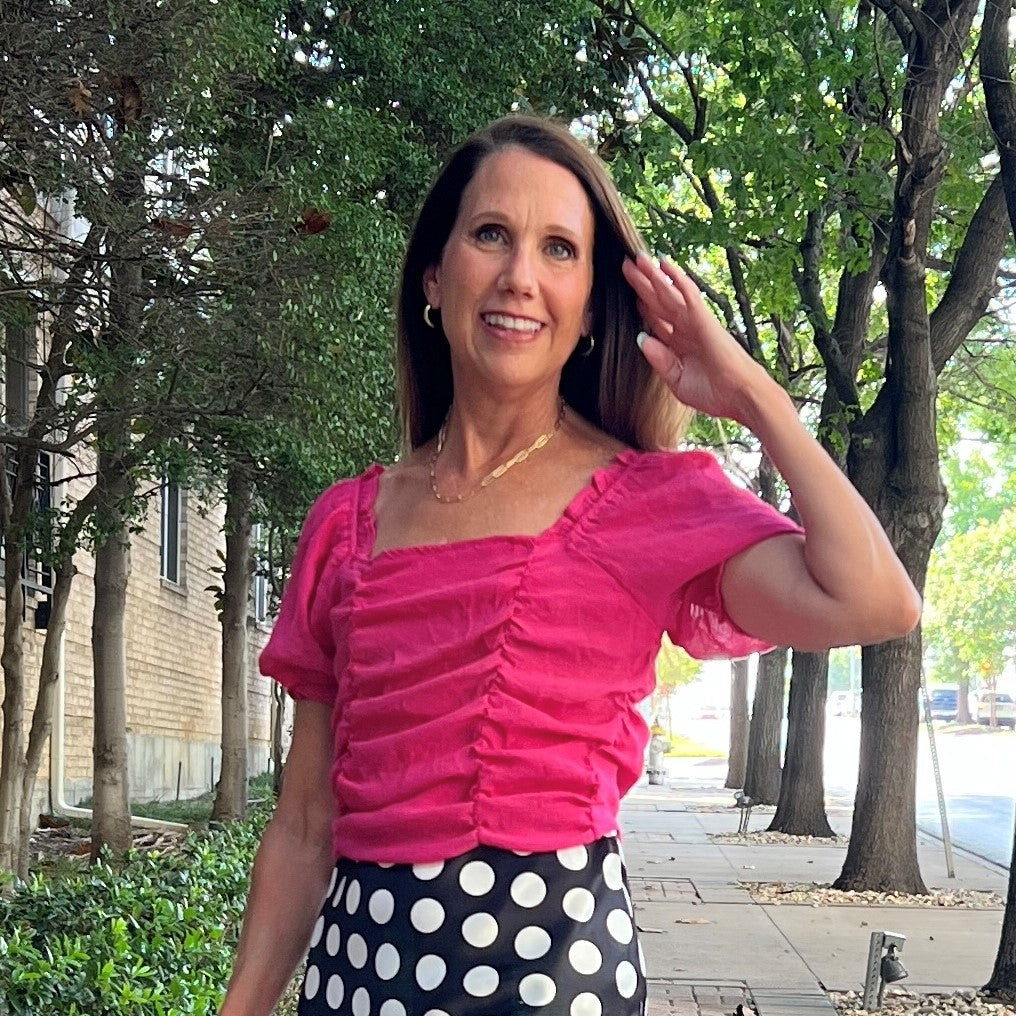 pink top with black polka dots